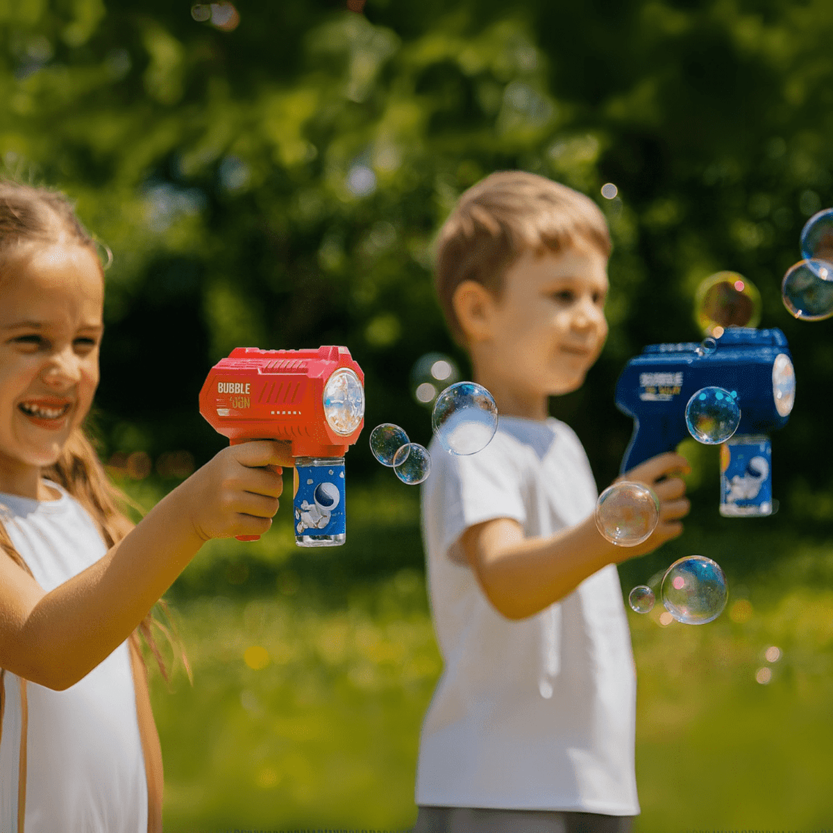 h032.png Two kids outdoors playing with bubble guns, smiling amid floating bubbles.